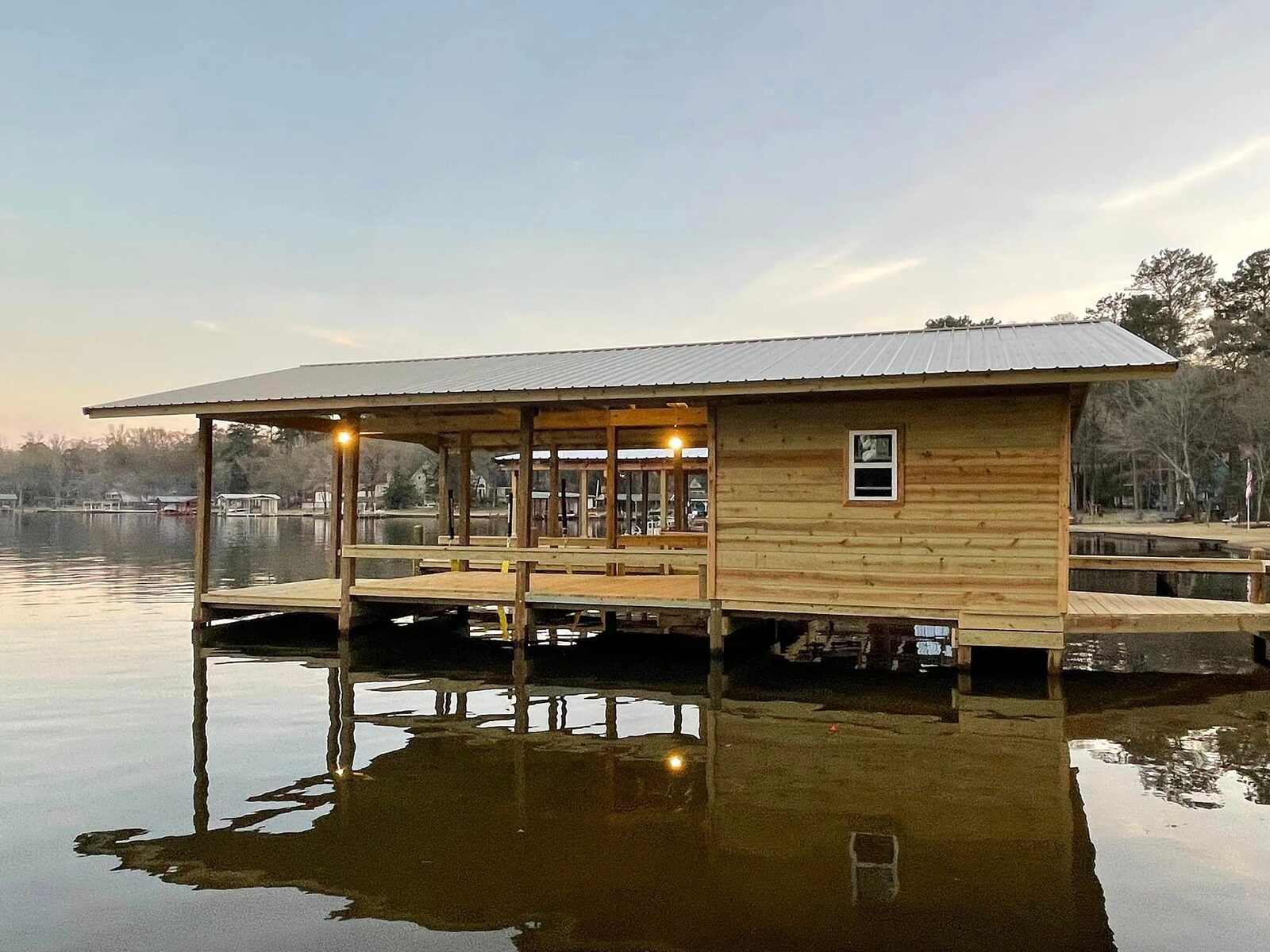 Cedar-clad boathouse built by Shoretech on Houston County Lake