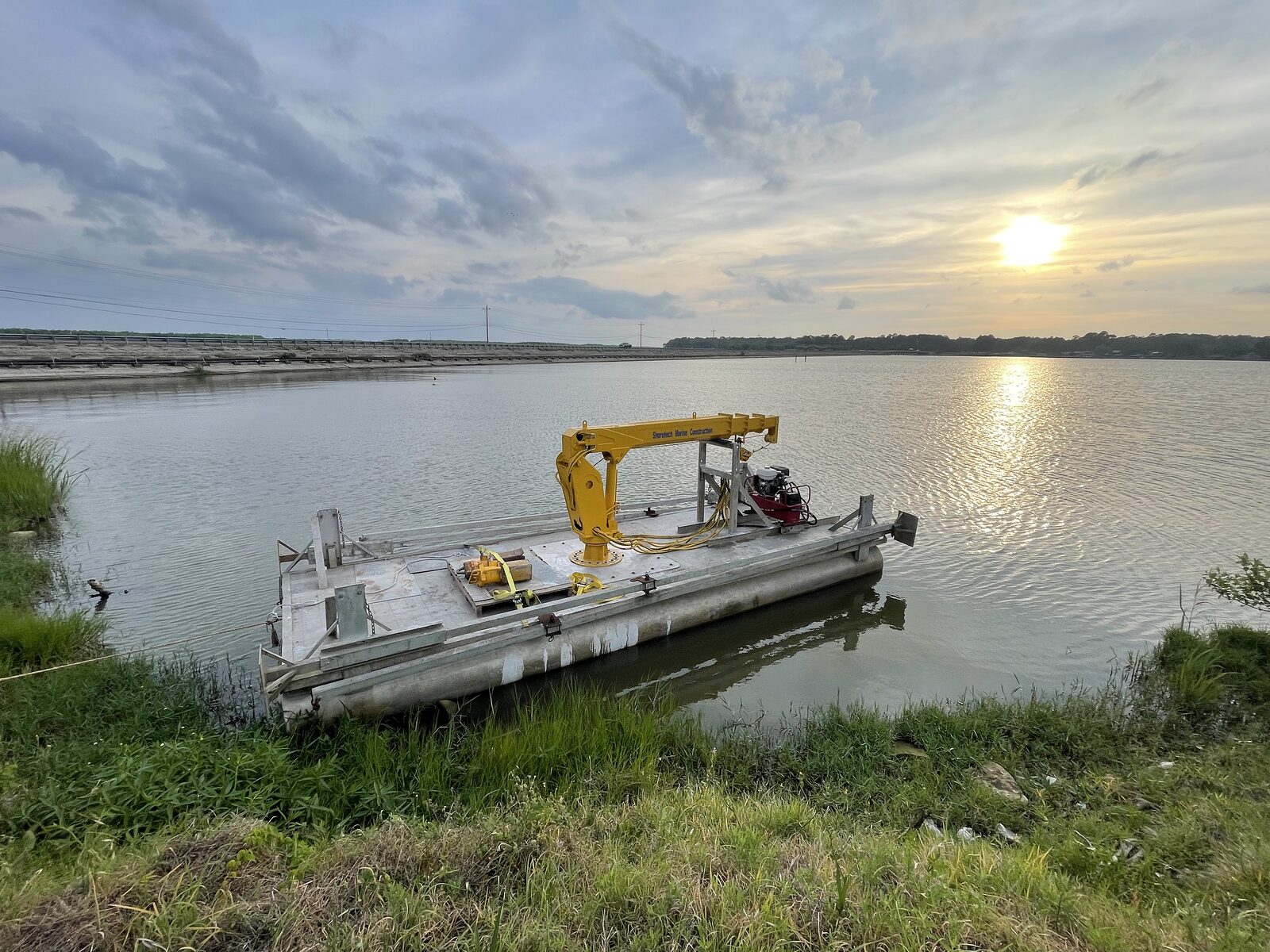 Shoretech's dredge barge at sunset on Lake Livingston, the company's home water