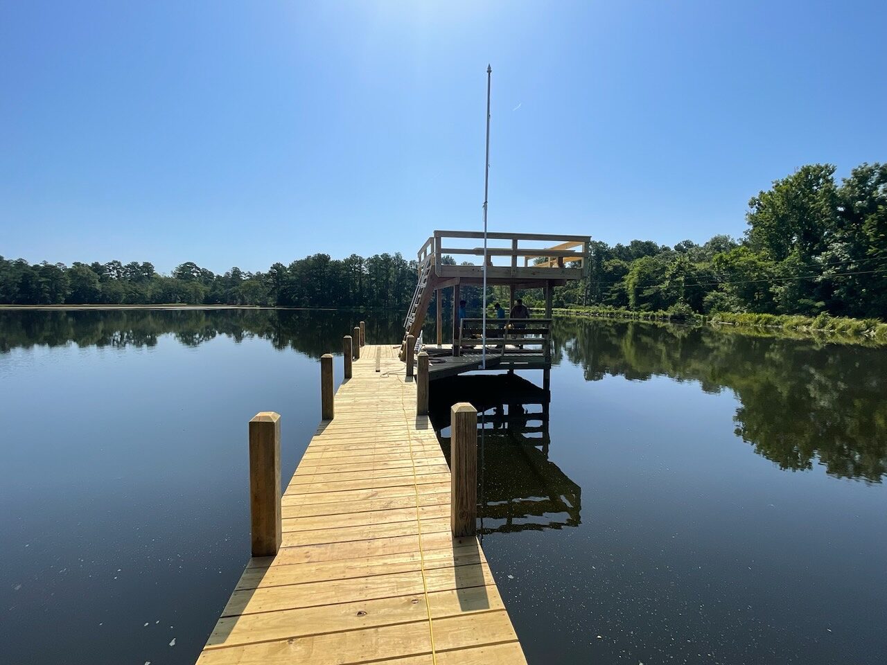 Finished timber swim pier with diving deck on a protected Texas waterfront in Lovelady