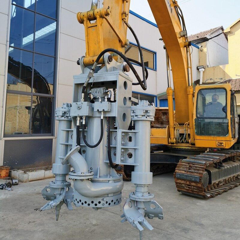 Close view of an excavator-mounted dredge head with twin cutter augers and a slurry pump between them