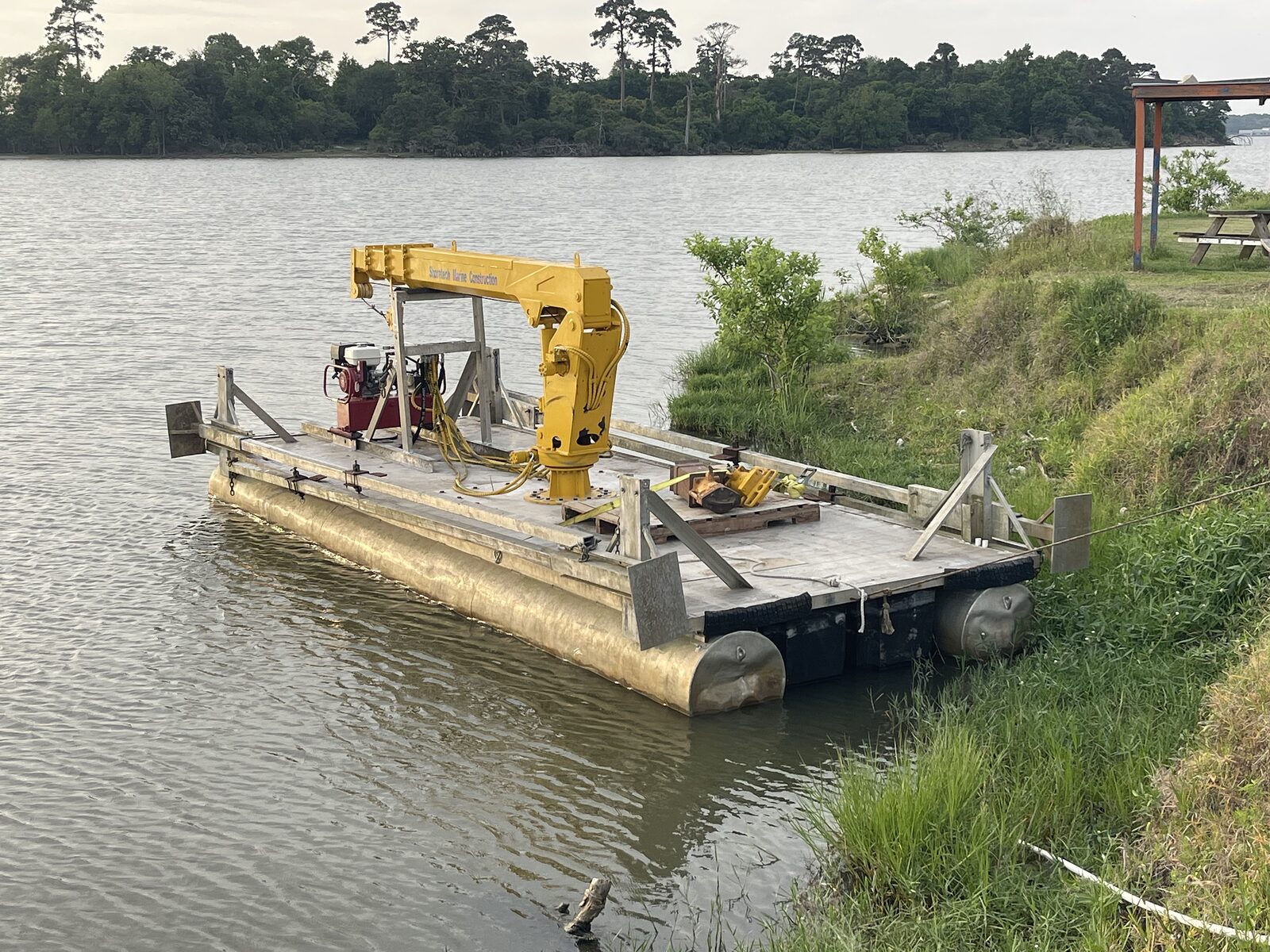 Shoretech's precision dredge barge working on Lake Livingston