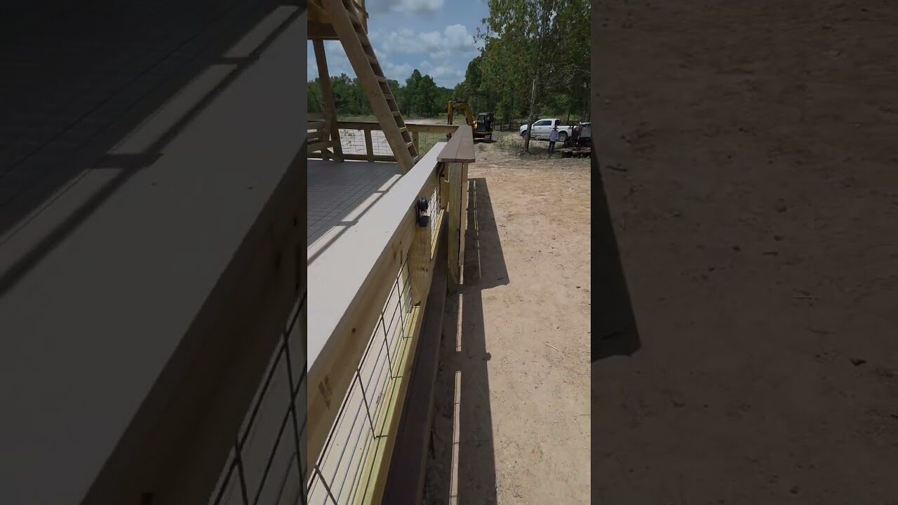 A boathouse door running on its overhead slide rail